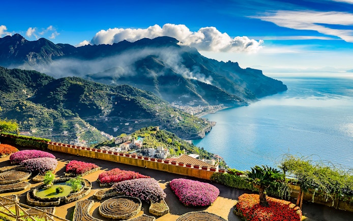 Amalfi Coast view from Ravello with terraced gardens and sea.