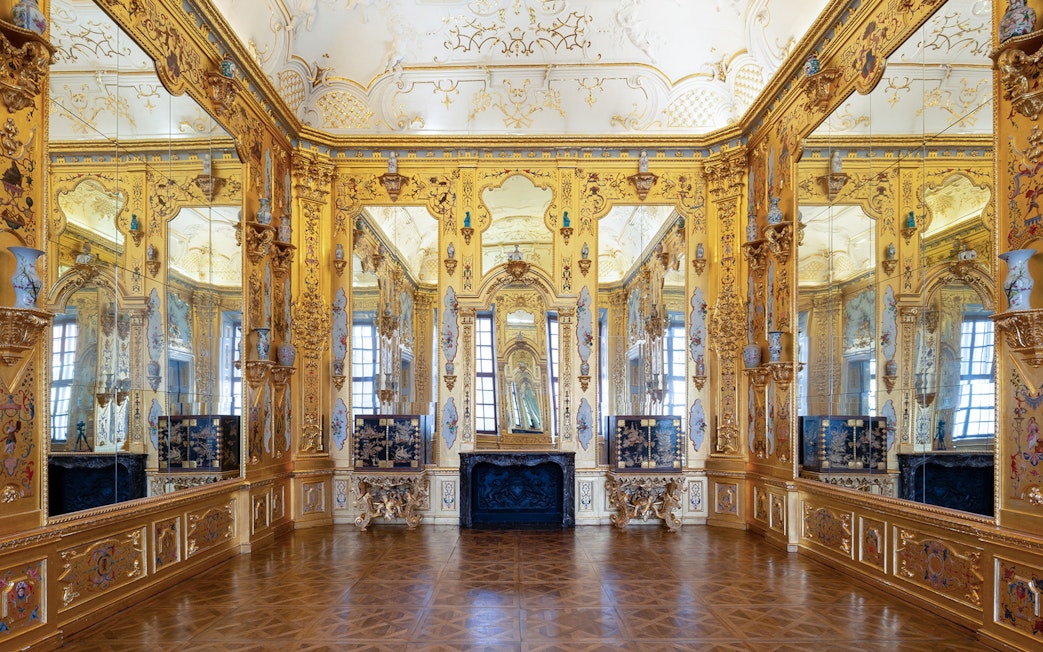 Ornate gold room interior at Upper Belvedere Palace, Vienna.