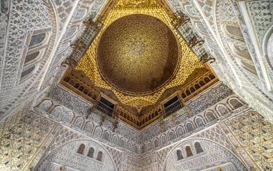 Alcazar of Seville gold ceiling with intricate patterns, Andalusia, Spain.
