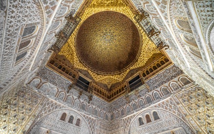 Alcazar of Seville gold ceiling with intricate patterns, Andalusia, Spain.