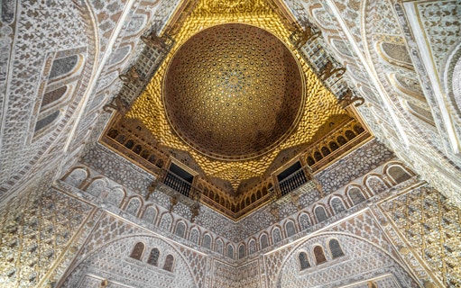 Alcazar of Seville gold ceiling with intricate patterns, Andalusia, Spain.
