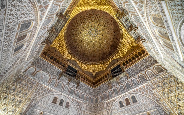Alcazar of Seville gold ceiling with intricate patterns, Andalusia, Spain.