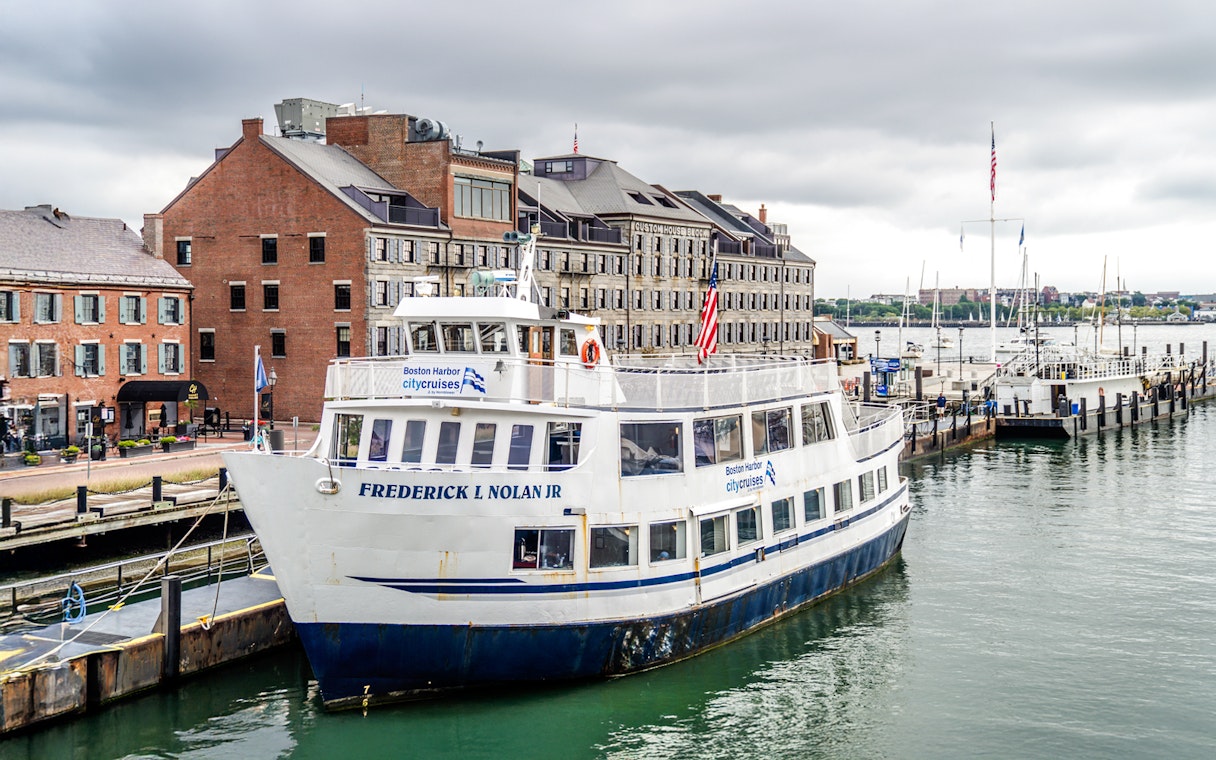 Frederick L Nolan Jr boat docked at Boston Harbor with historic buildings in the background