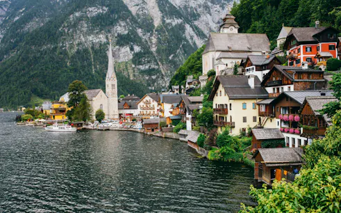 Village of Hallstatt along Lake Hallstatt with alpine backdrop, Salzkammergut, Austria.