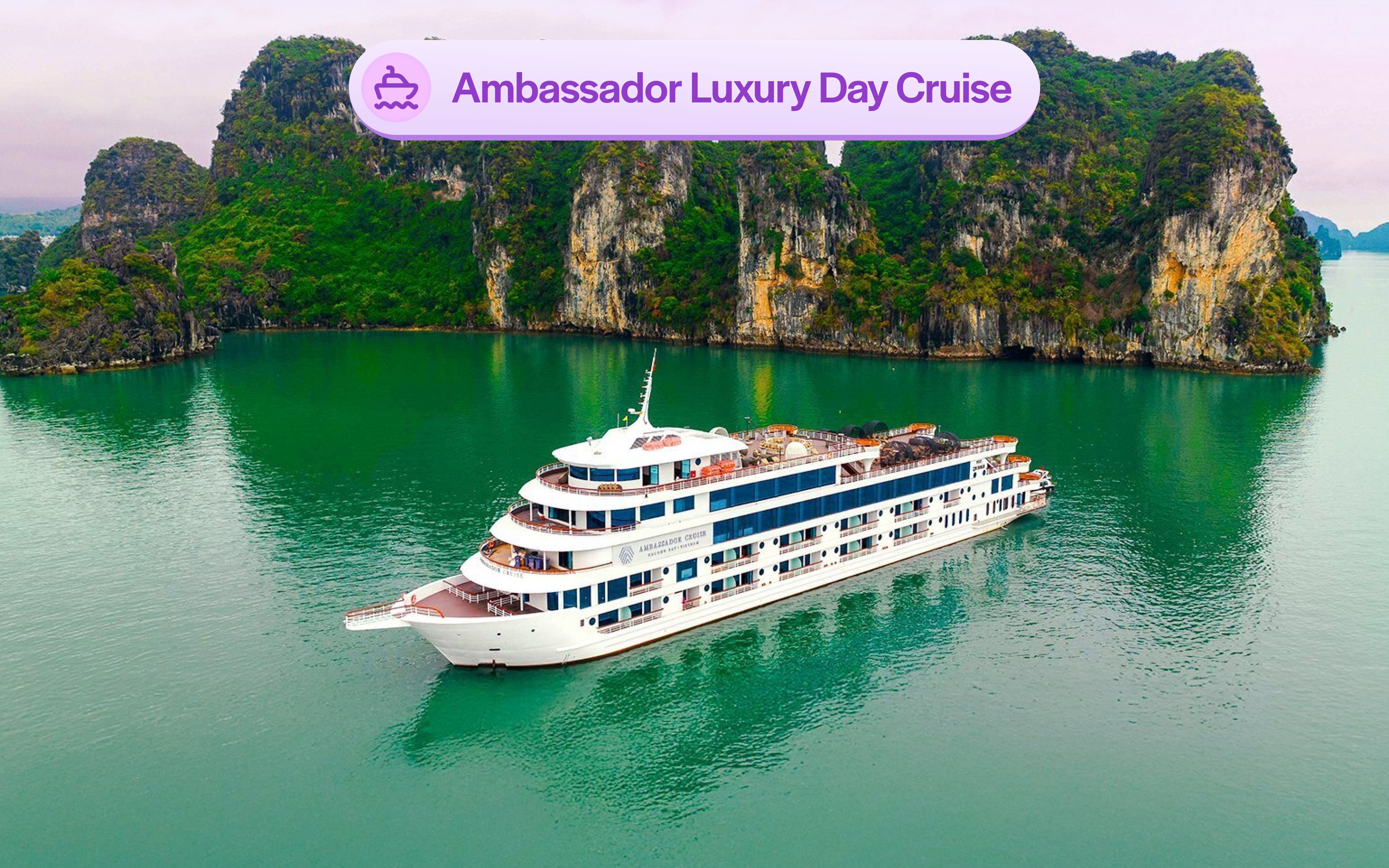 Aerial view of Ambassador cruise ship in Halong Bay, Vietnam, near limestone islands.