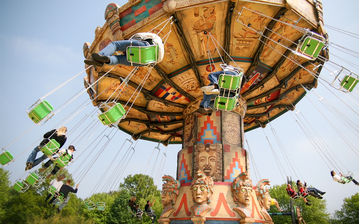 Swing ride at Heide Park with people enjoying the attraction.