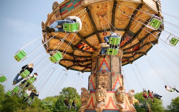 Swing ride at Heide Park with people enjoying the attraction.