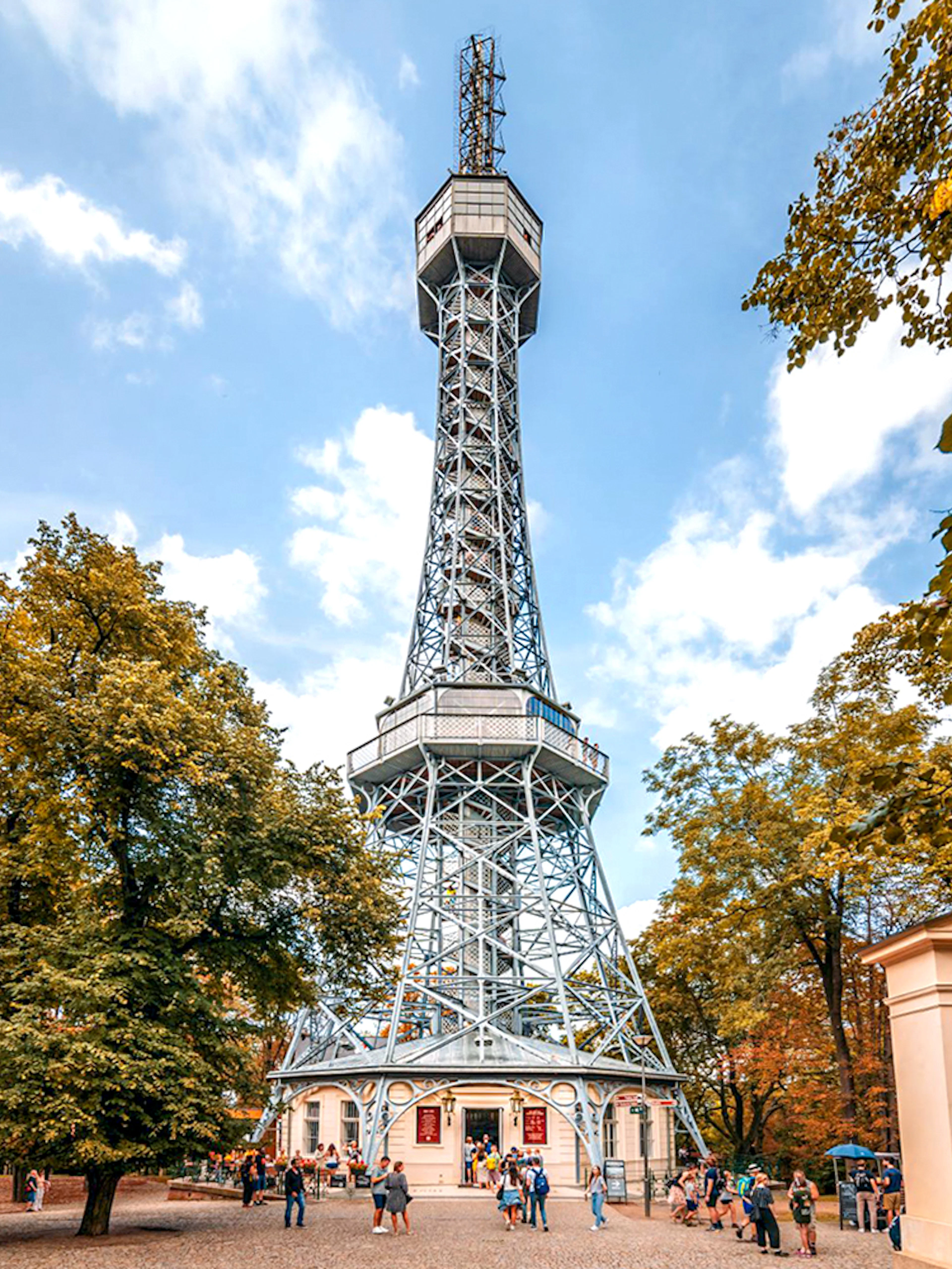 Petrin Tower exterior surrounded by trees in Prague, Czech Republic.