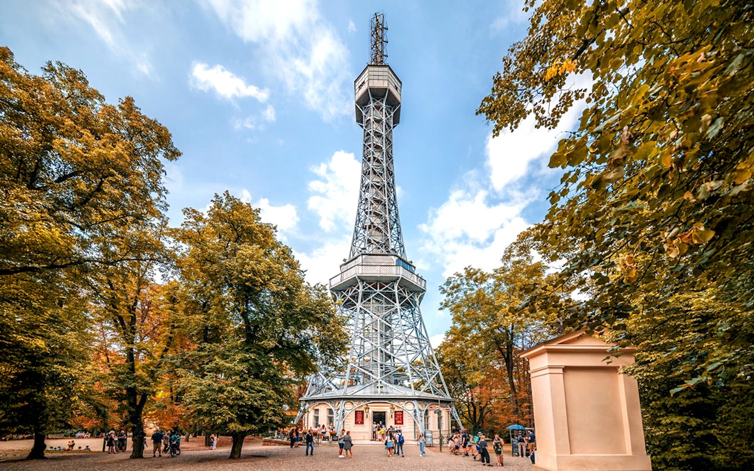 Petrin Tower exterior surrounded by trees in Prague, Czech Republic.