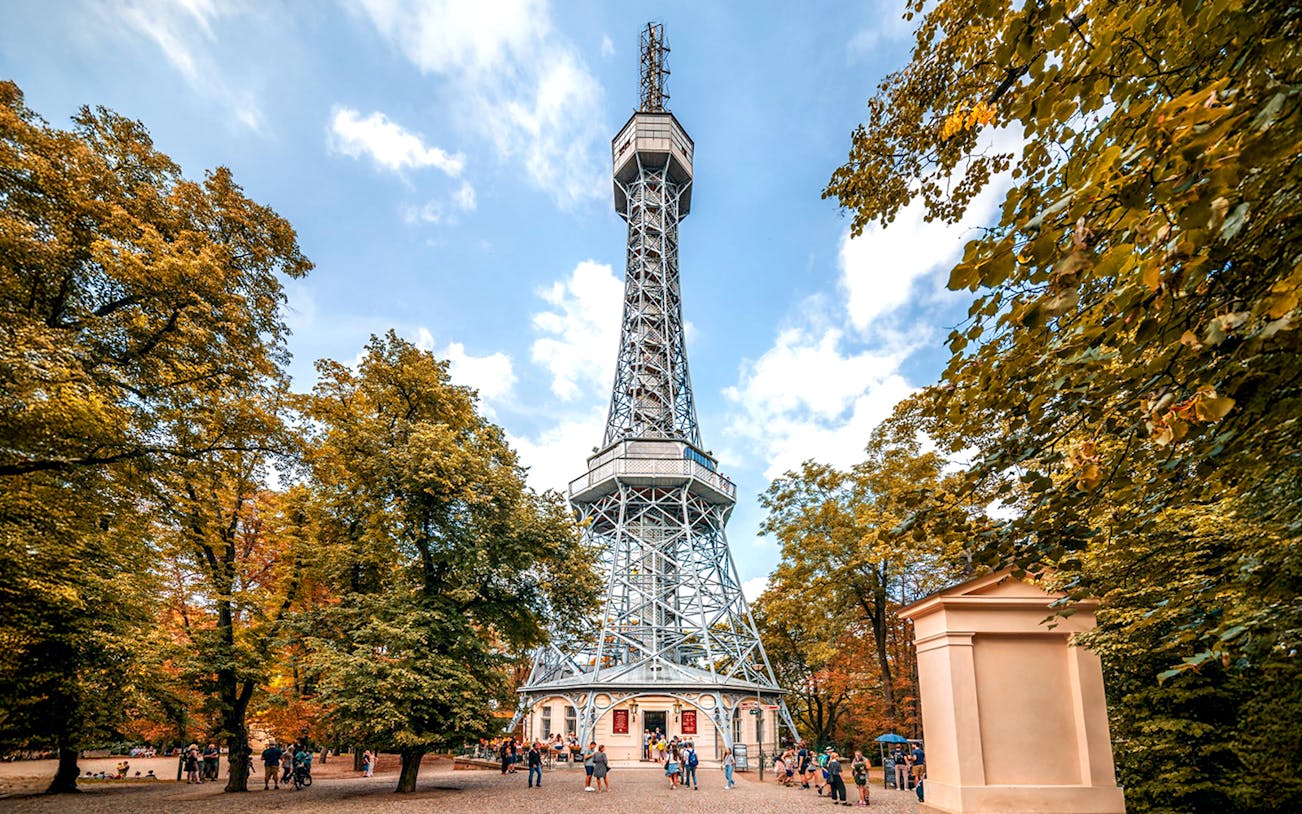 Petrin Tower exterior surrounded by trees in Prague, Czech Republic.