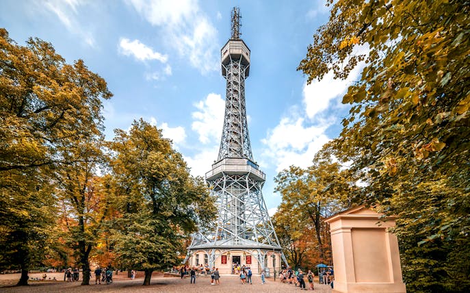 Petrin Tower exterior surrounded by trees in Prague, Czech Republic.
