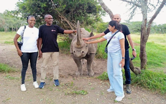 Group interacting with a rhino at Ol Pejeta Conservancy, Kenya.