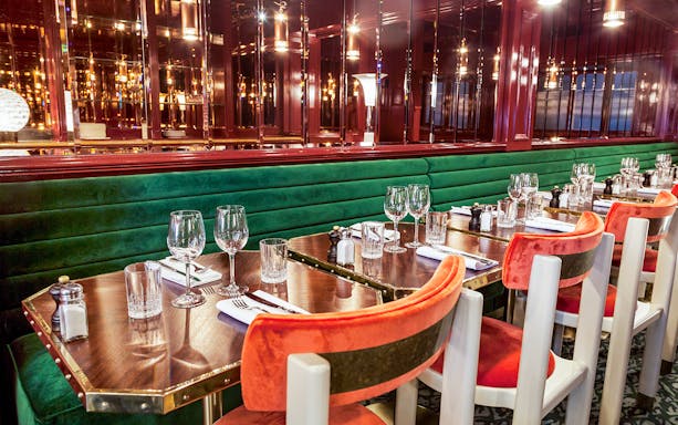 Dining setup at Opéra-Grand Café Capucines, Paris with elegant table settings.