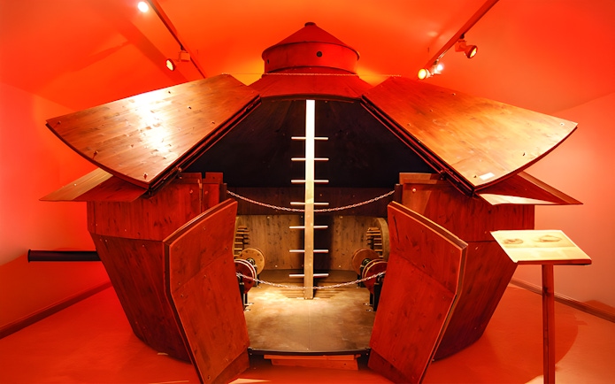 Leonardo da Vinci museum exhibit featuring a wooden armored vehicle model.