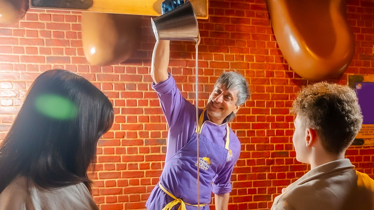 Visitors engaging in chocolate-making activities at the Have a Go Zone, Cadbury World, Birmingham.