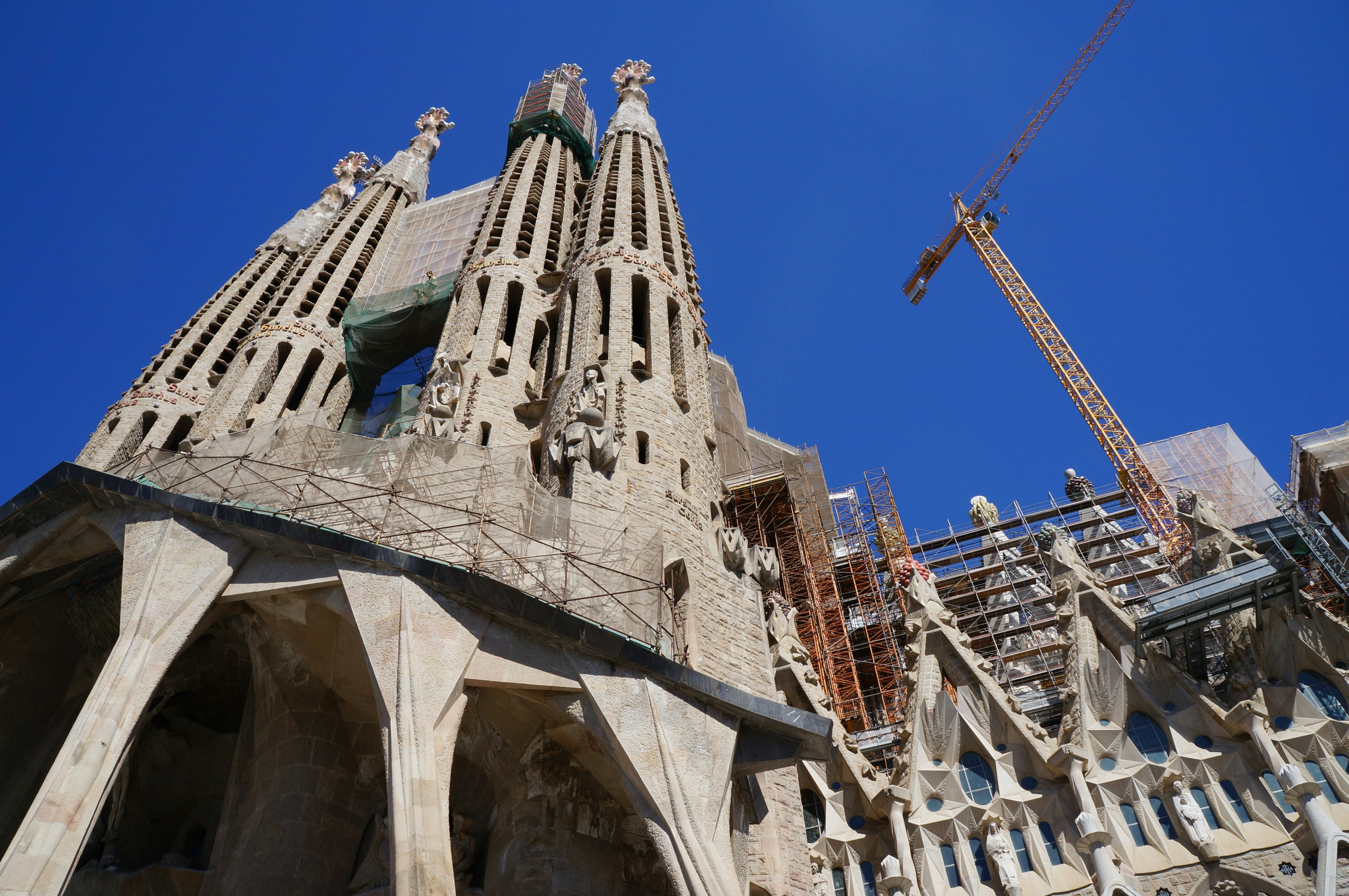 Sagrada Familia Passion façade with crane in Barcelona under construction.