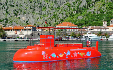 Speed boat in Boka Bay, Kotor with colorful marine designs.