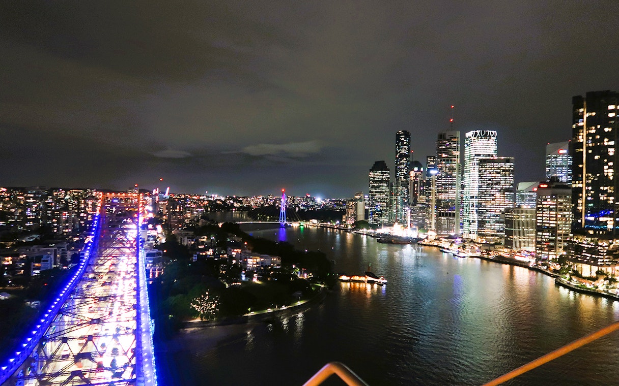 Night view from Story Bridge Adventure Climb, overlooking Brisbane city skyline and river.