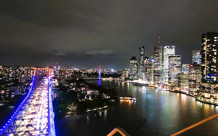Night view from Story Bridge Adventure Climb, overlooking Brisbane city skyline and river.
