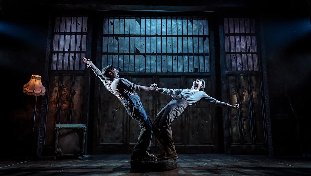 Two actors perform a dramatic scene in a Bonnie & Clyde stage production.