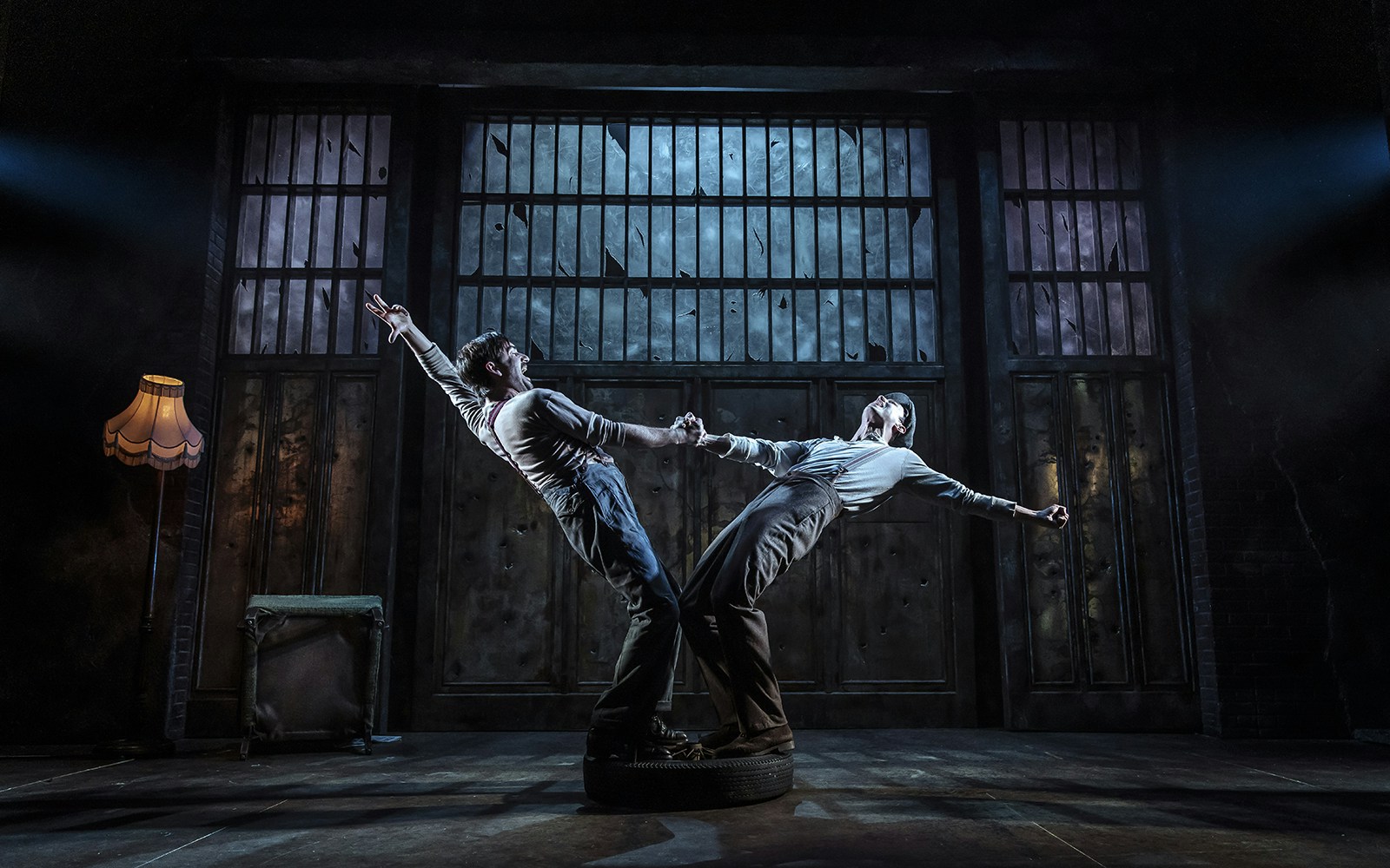 Two actors perform a dramatic scene in a Bonnie & Clyde stage production.