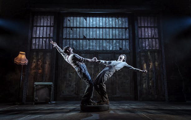 Two actors perform a dramatic scene in a Bonnie & Clyde stage production.