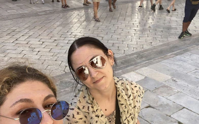 Tourists exploring Dubrovnik's medieval streets during a self-guided city game.