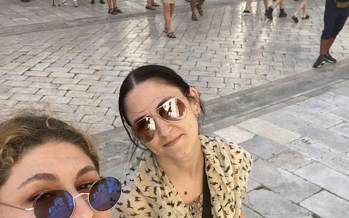 Tourists exploring Dubrovnik's medieval streets during a self-guided city game.