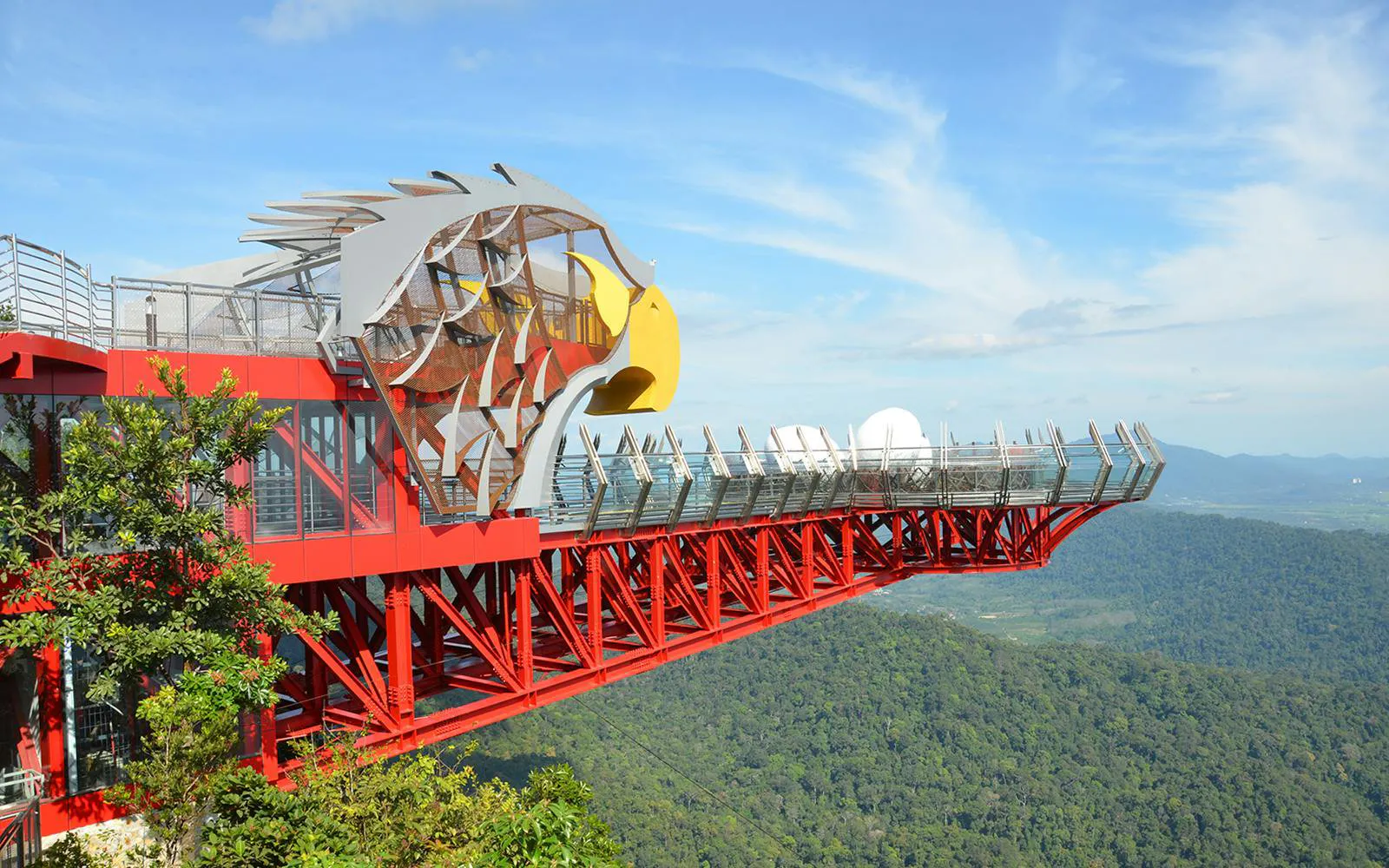 Langkawi SkyBridge with eagle-themed platform overlooking lush forest.