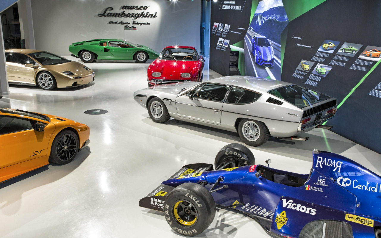 Classic and modern Lamborghini cars displayed at Ferruccio Lamborghini Museum, Bologna, Italy.