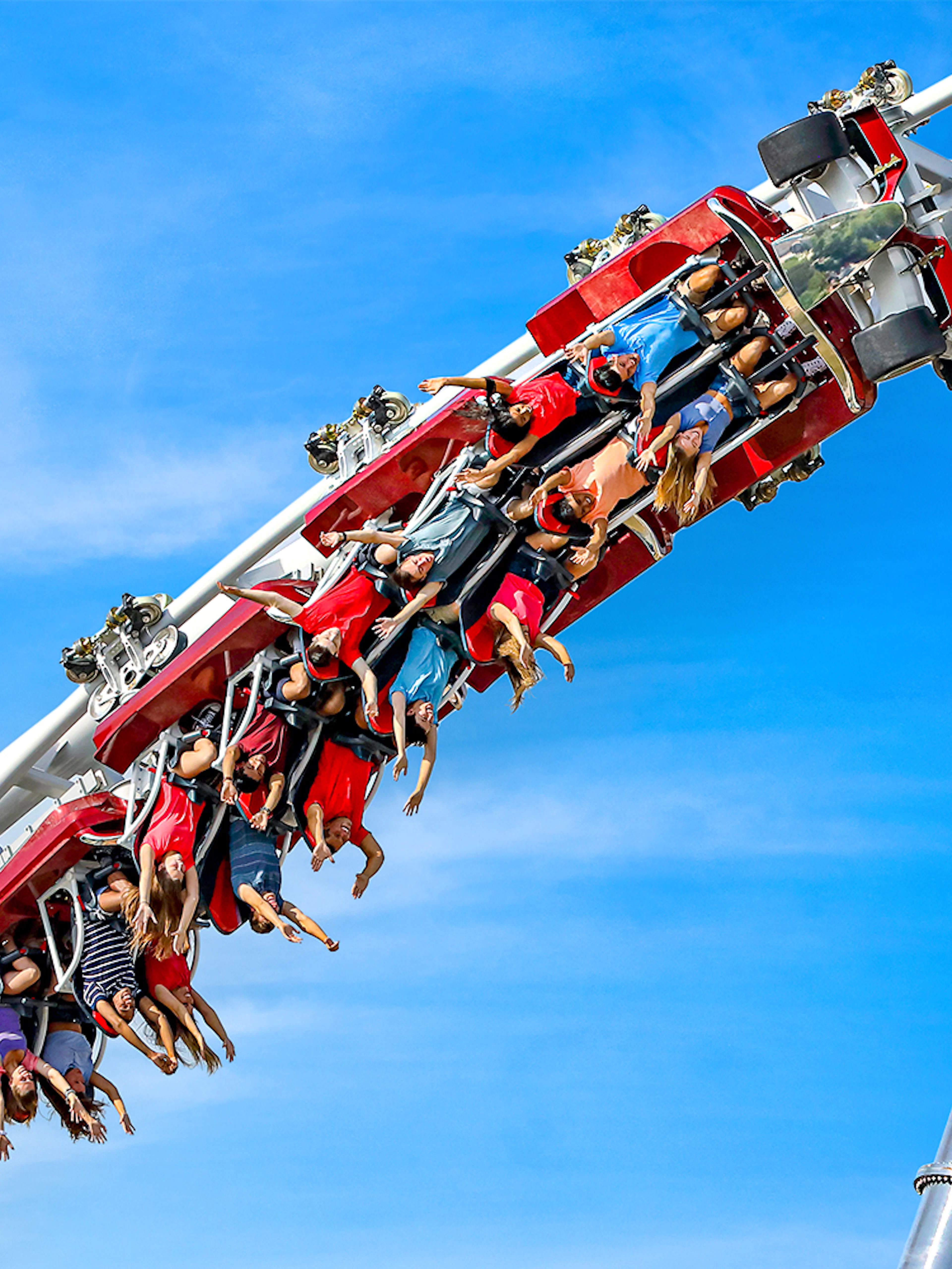 Riders upside down on Maxx Force roller coaster at Six Flags Great America.