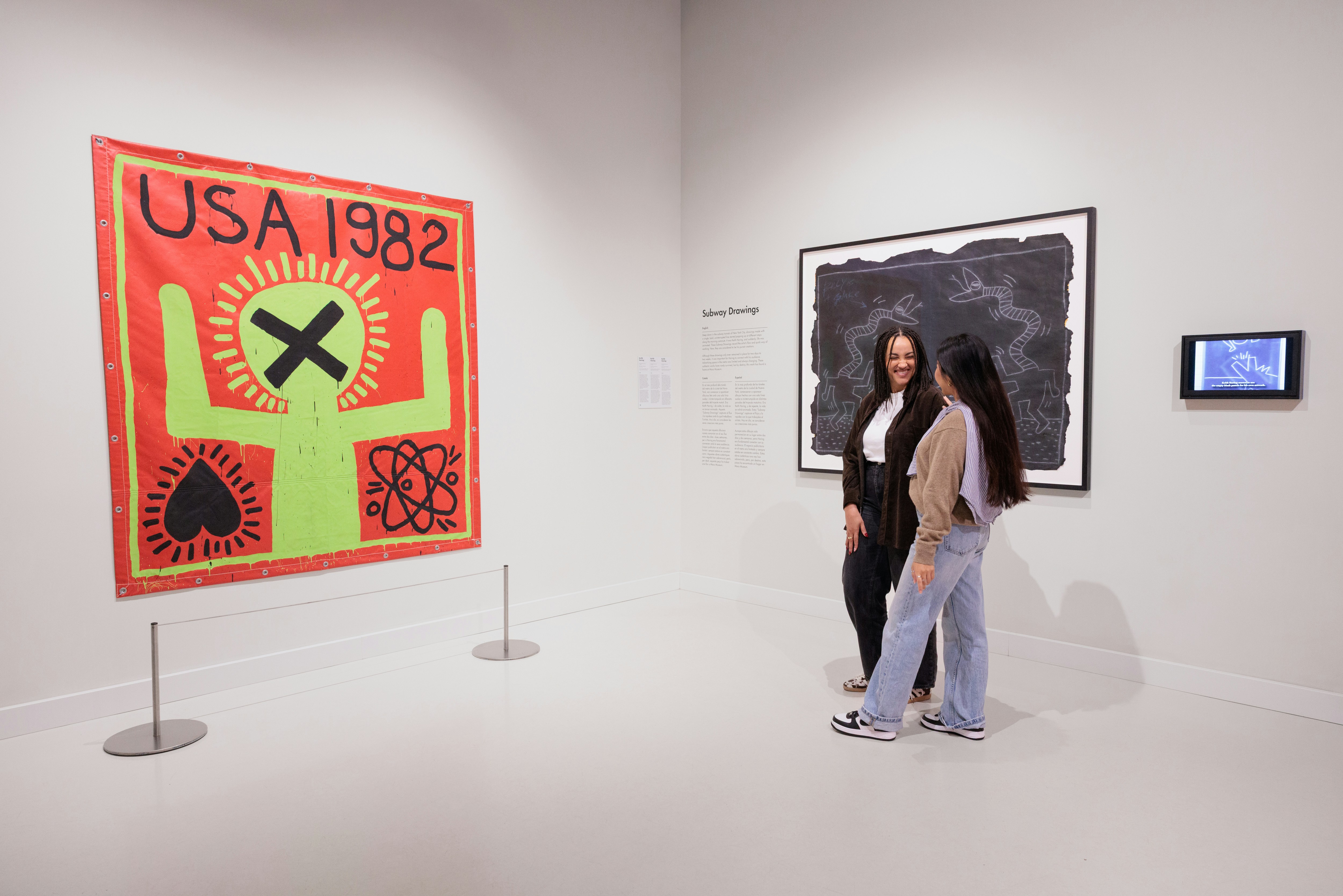 Visitors viewing Keith Haring artwork at Moco Museum Barcelona.