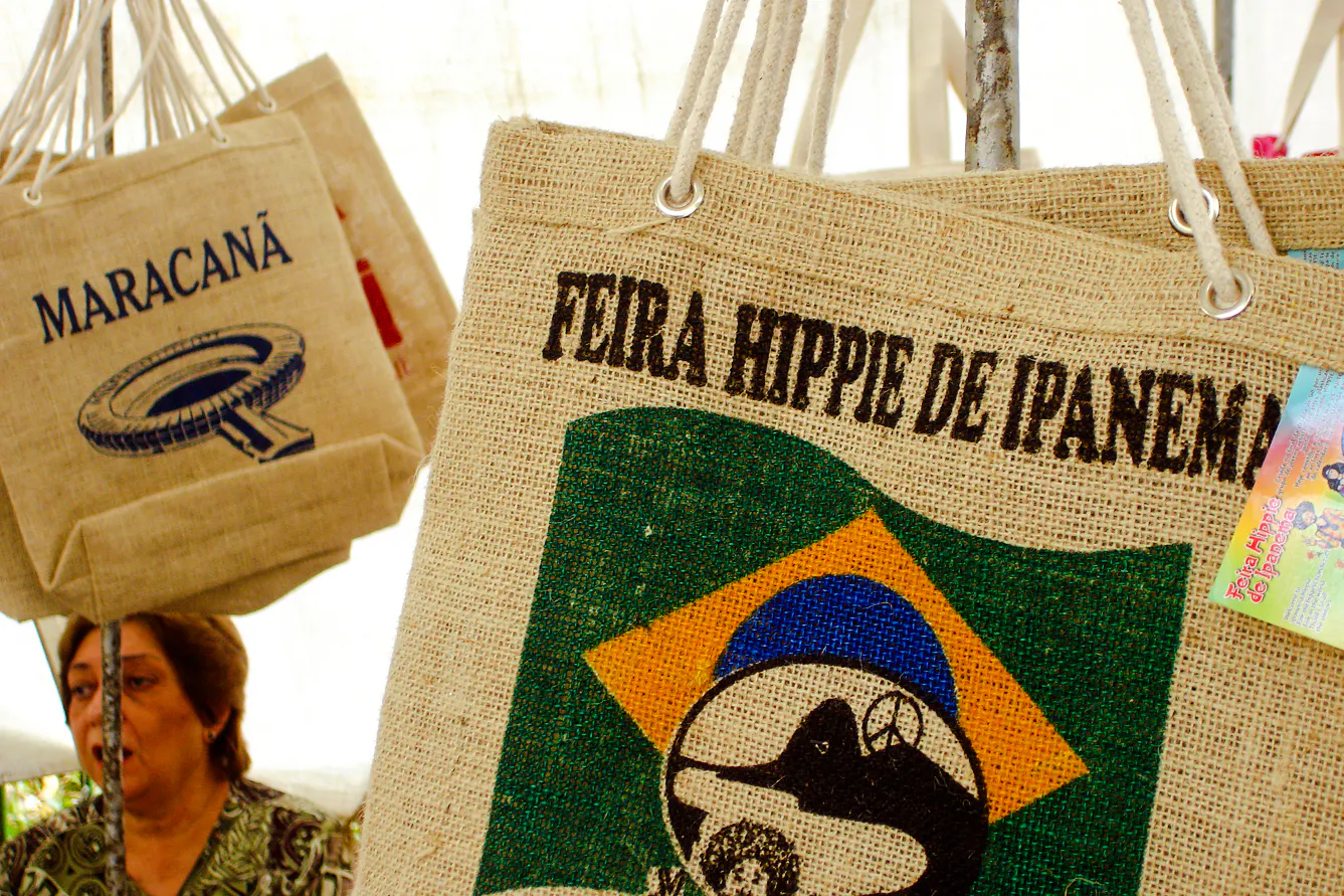 Burlap bags at Ipanema Hippie Fair, Rio de Janeiro, featuring local designs and cultural motifs.