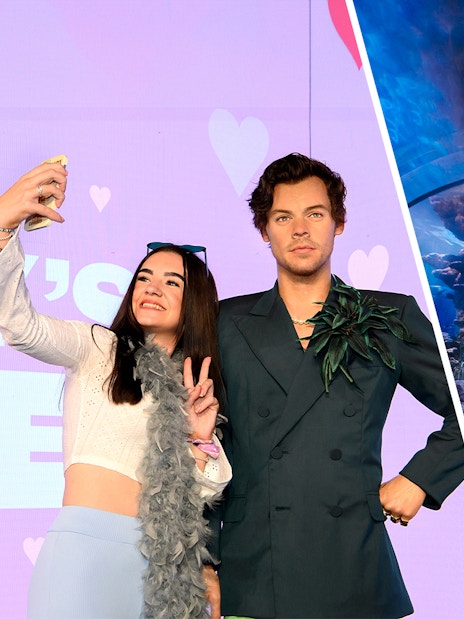 Madame Tussauds wax figure and family exploring SEA LIFE London Aquarium tunnel.