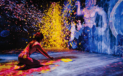 Visitor engaging with digital art at Akara Sky Hanuman, Bangkok.