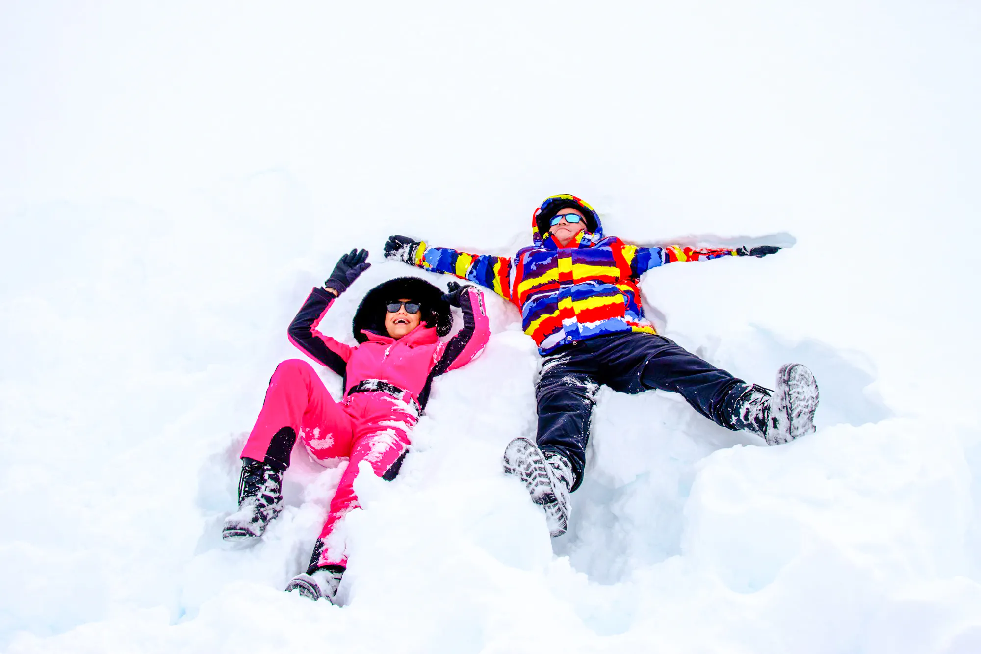 Two people making snow angels at Valle Nevado, Santiago.