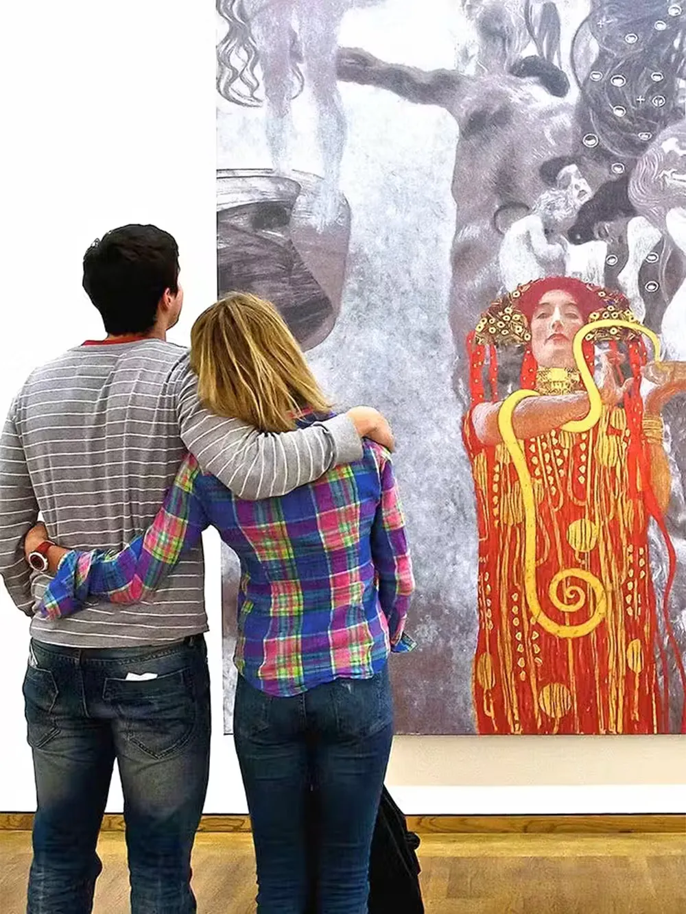 Visitors viewing a Klimt painting at the Leopold Museum, Vienna.