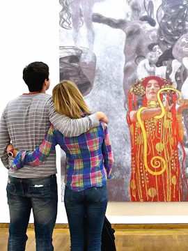 Visitors viewing a Klimt painting at the Leopold Museum, Vienna.