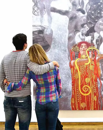 Visitors viewing a Klimt painting at the Leopold Museum, Vienna.