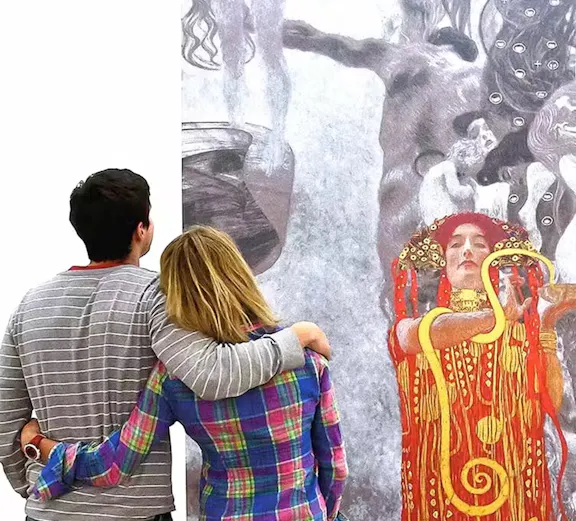 Visitors viewing a Klimt painting at the Leopold Museum, Vienna.