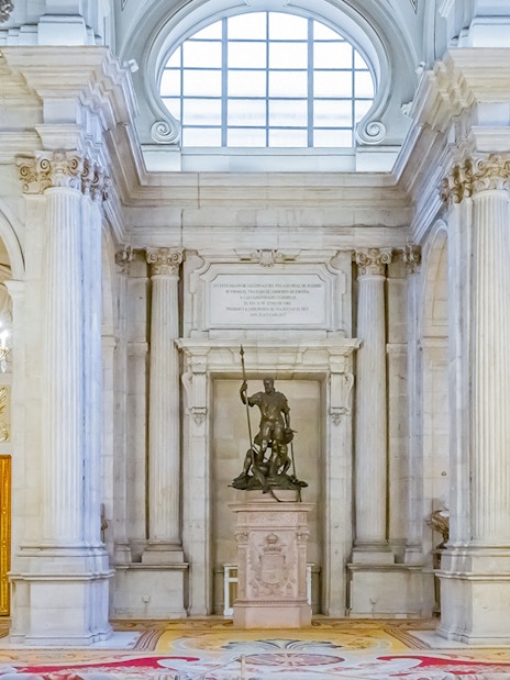 Royal Palace of Madrid interior with grand chandeliers and statues, part of a combo tour with Royal Collections Gallery.