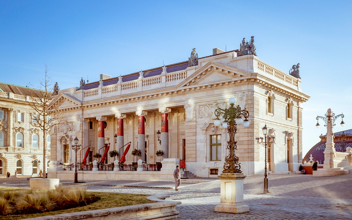 Hungarian Royal Guard and Riding Hall in Budapest with ornate architecture.