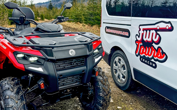 Quad bike and tour van in Zakopane forest setting.