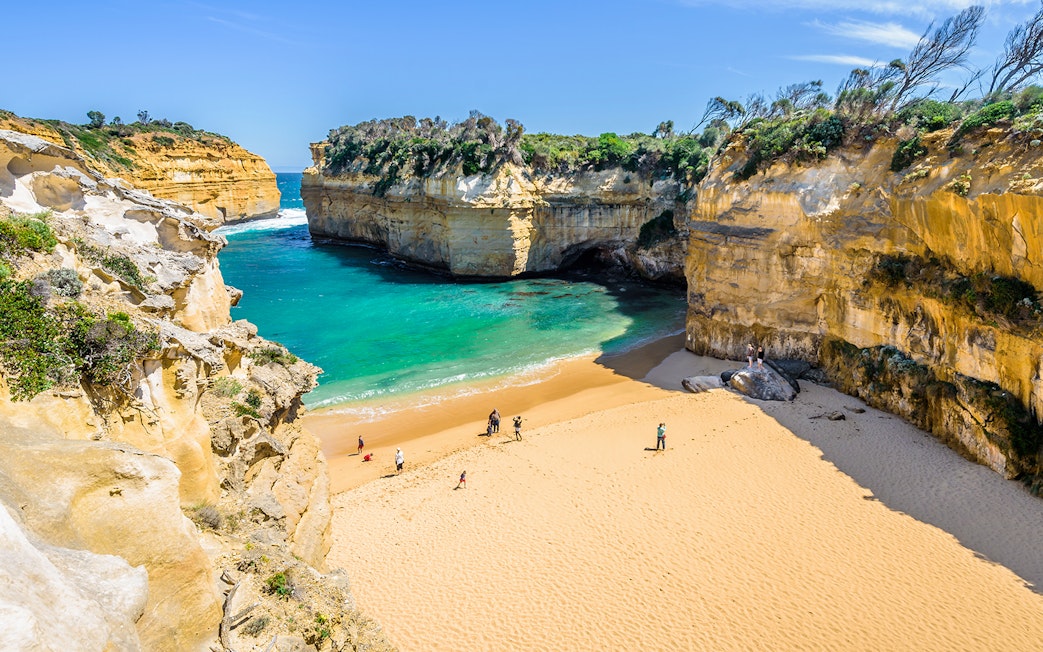 Loch Ard Gorge beach with cliffs and turquoise water, Great Ocean Road, Australia.