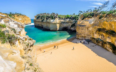Loch Ard Gorge beach with cliffs and turquoise water, Great Ocean Road, Australia.