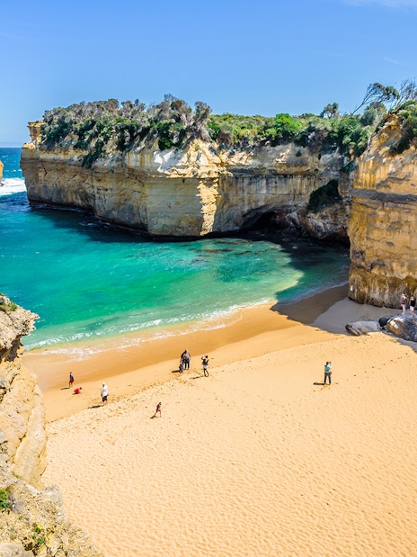 Loch Ard Gorge beach with cliffs and turquoise water, Great Ocean Road, Australia.