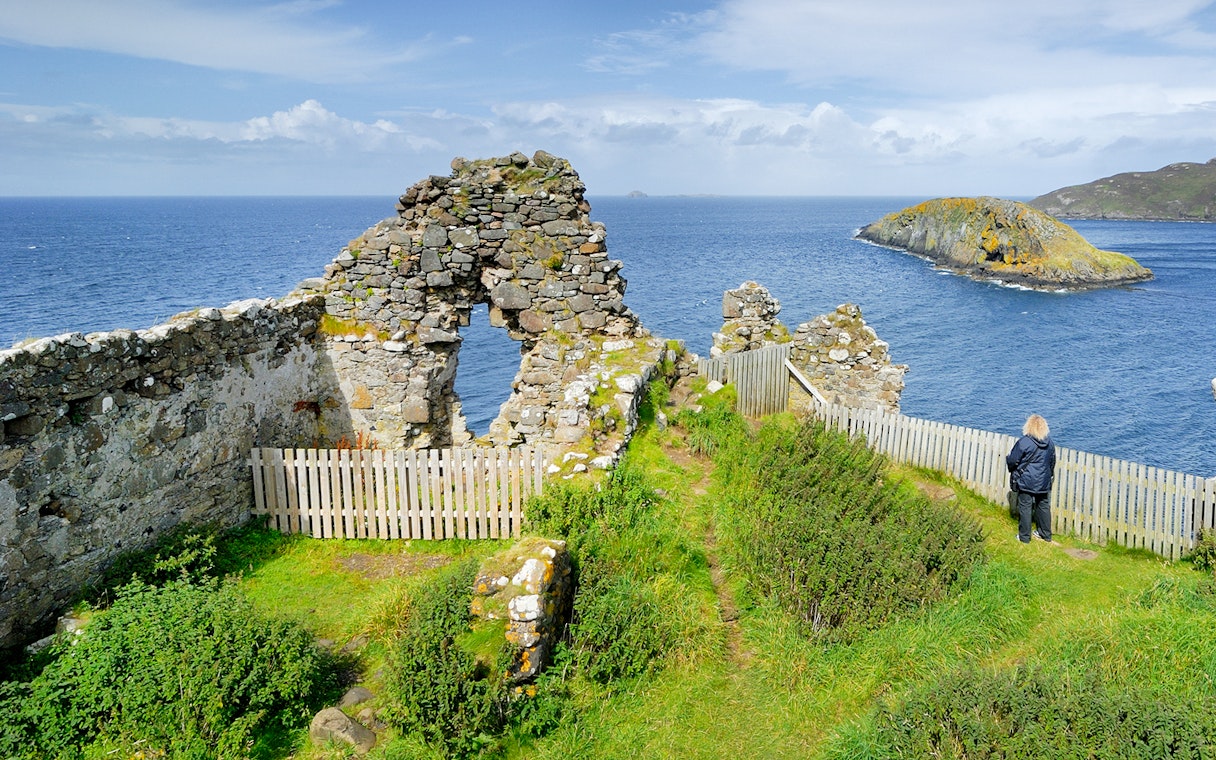 Ruins overlooking the sea on the Isle of Skye, part of The Highlands & Loch Ness Tour.