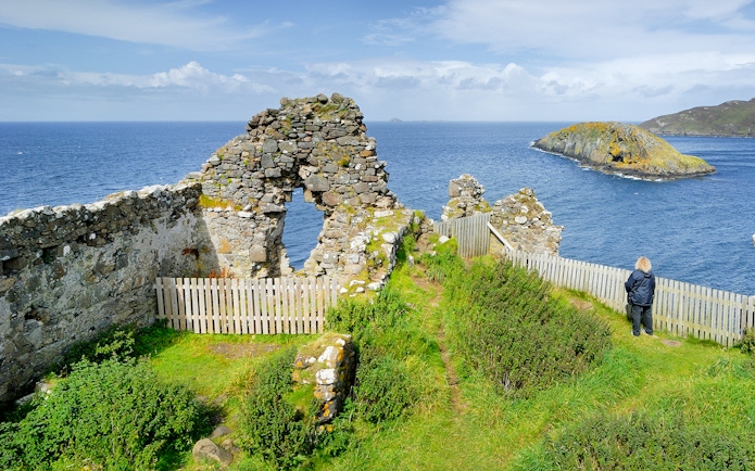 Ruins overlooking the sea on the Isle of Skye, part of The Highlands & Loch Ness Tour.