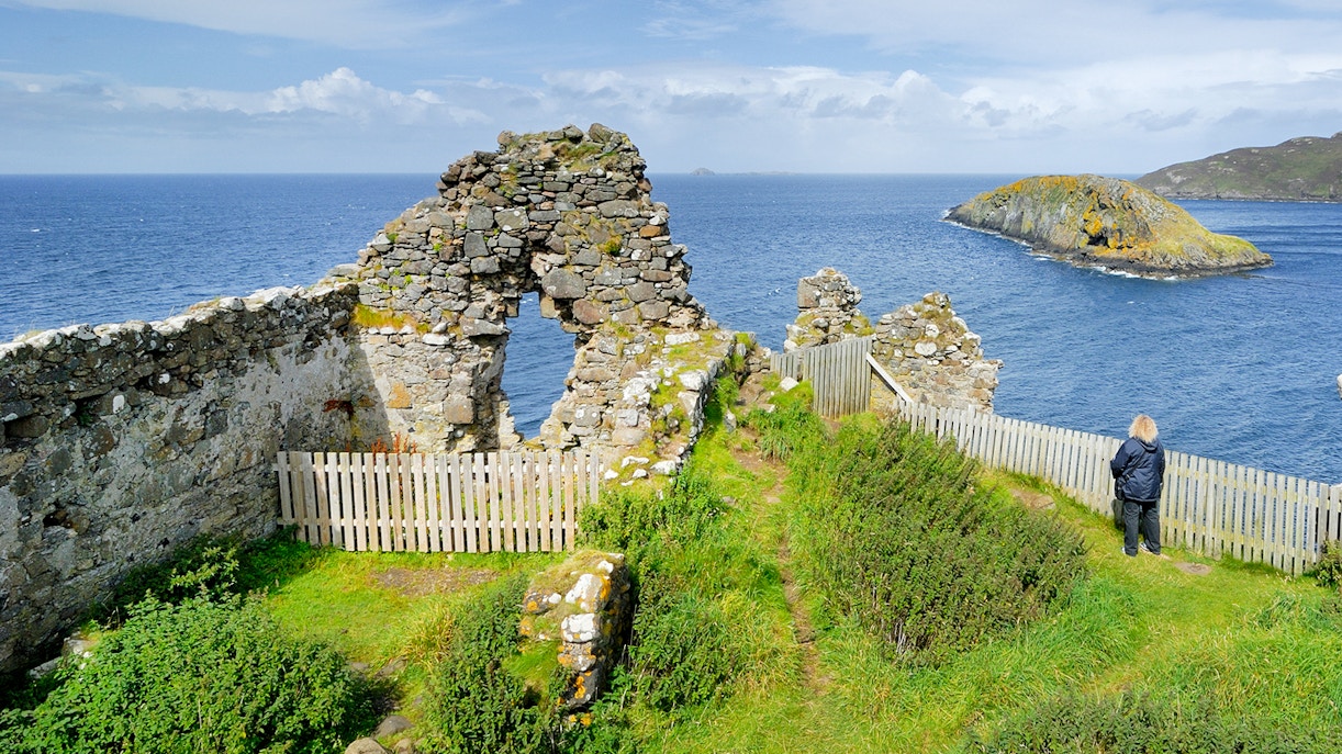 Ruins overlooking the sea on the Isle of Skye, part of The Highlands & Loch Ness Tour.