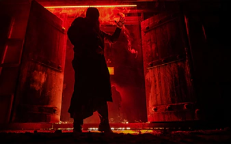 Person silhouetted in red-lit room with Stranger Things theme.